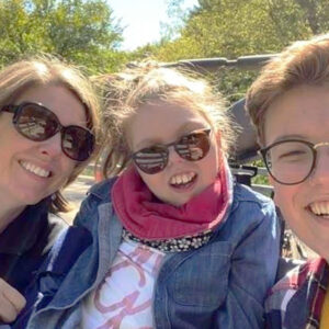 Three people smiling for the camera